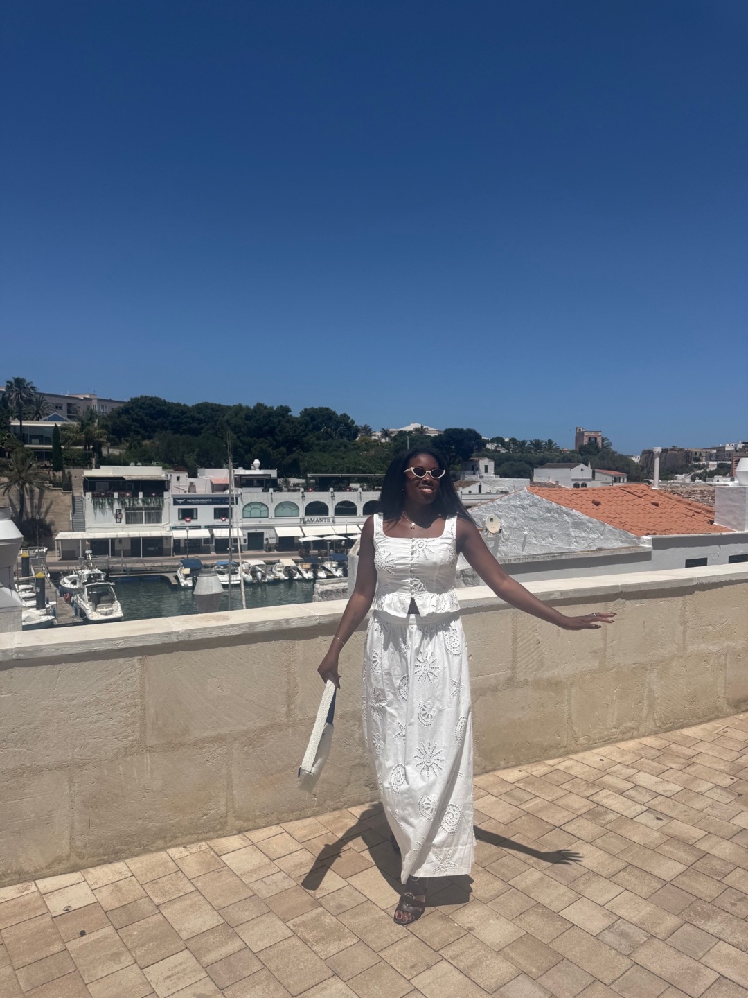 Rashana overlooking the harbor in Menorca, Spain